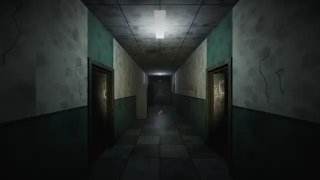 The ground-floor hallway of Ikenga Memorial: cracked walls, one working tube light, doors on both sides.